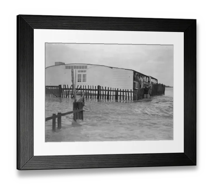 Framed Print : Sea defences broken by flood tide at Winchelsea, bungalows flooded and holidaymakers Framed Print : Sea defences broken by flood tide at Winchelsea, bungalows flooded and holidaymakers