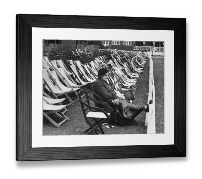 Framed Print : In glorious isolation, this hardy woman cricket enthusiast sat in the reserved Framed Print : In glorious isolation, this hardy woman cricket enthusiast sat in the reserved