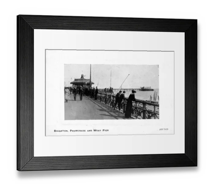 Framed Print : Some people walking along the seafront, Promenade and West Pier, Brighton, East Sussex