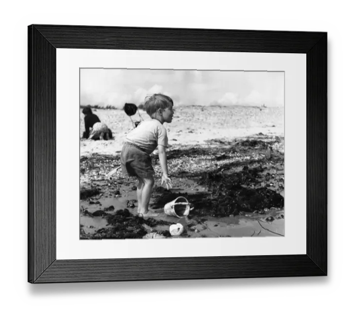 Framed Print : Small boy playing on the beach at Elmer Sands, Sussex, 1950 s Framed Print : Small boy playing on the beach at Elmer Sands, Sussex, 1950 s