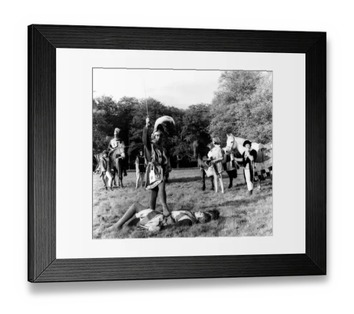 Framed Print : Rehearsing Medieval Jousting A victorius knight stands over his opponent during Framed Print : Rehearsing Medieval Jousting A victorius knight stands over his opponent during