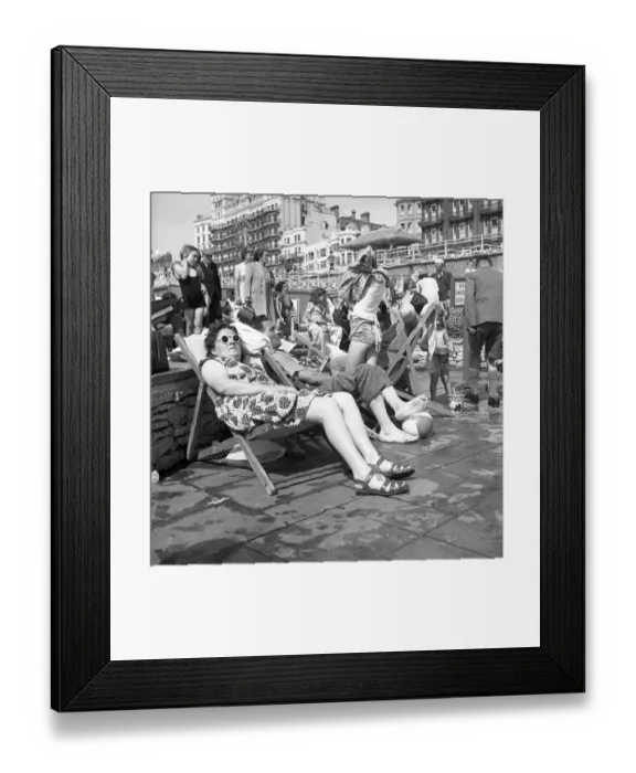 Framed Print : Brighton Enjoying the sunshine in Brighton relaxing in a deckchair 1950 Framed Print : Brighton Enjoying the sunshine in Brighton relaxing in a deckchair 1950