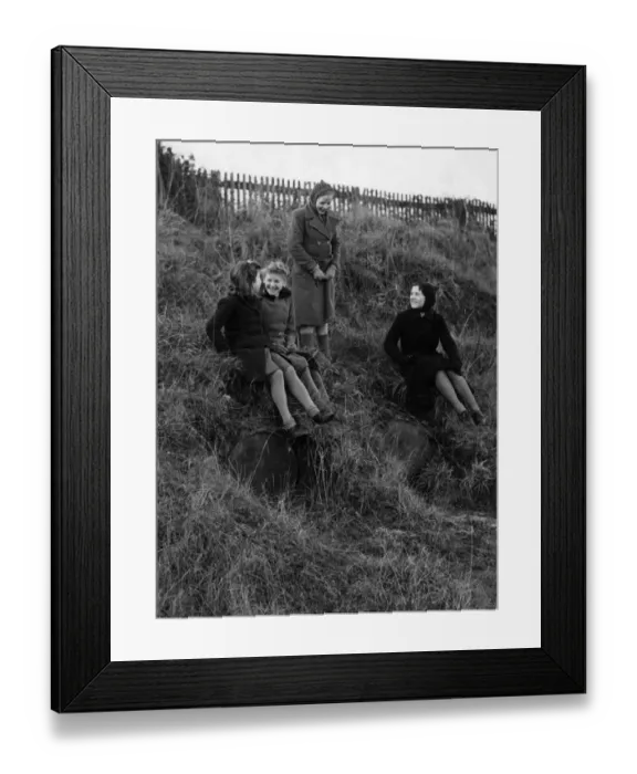 Framed Print : Children playing on the hill where flame bomb containers are still stored at Crowhurst