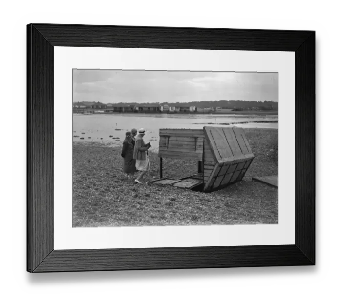 Framed Print : Sea defences broken by flood tide at Winchelsea, bungalows flooded and holidaymakers