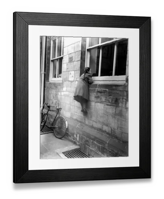 Framed Print : A young girl climbs up to look into the courtroom at Horsham Framed Print : A young girl climbs up to look into the courtroom at Horsham