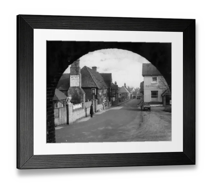 Framed Print : The old world village of Pevensey in Sussex. On the left is the historical 16th century Mint House Framed Print : The old world village of Pevensey in Sussex. On the left is the historical 16th century Mint House