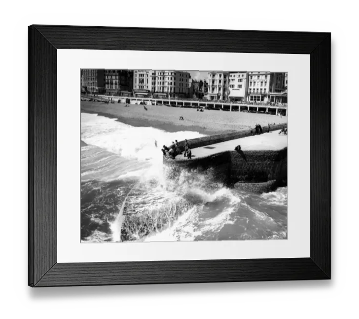 Framed Print : 31 May 1958 Visitors to Brighton watch as seas break against the Groyne - ever