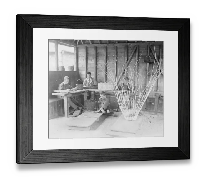 Framed Print : A disabled soldier and children basket weaving at the Princess Louise Military Orthopaedic
