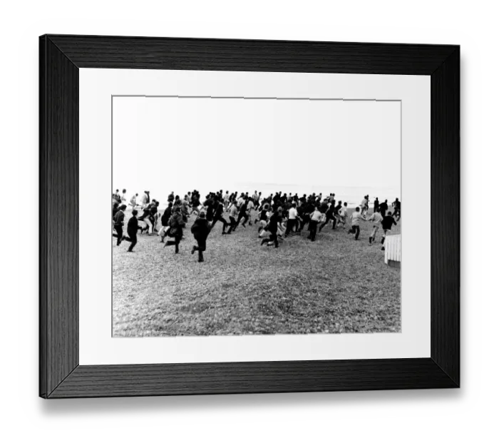 Framed Print : 1964. Hastings. Mods and Rockers clash. 3rd August. Racing along the beach