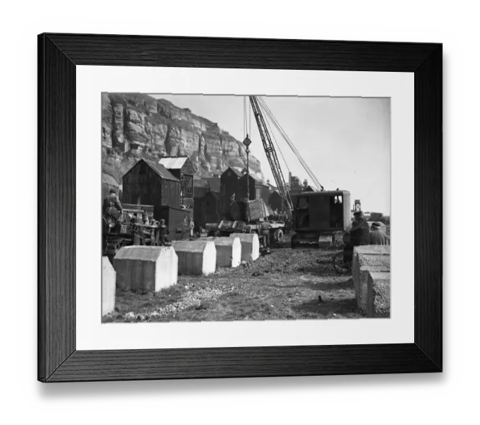 Framed Print : Royal Engineers are removing the concrete dragons teeth defence blocks on the front at Hastings