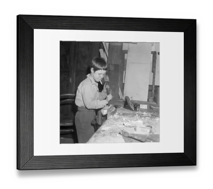 Framed Print : Burgess Hill, Sussex, England : Concentration on carpentry calls for a cigarette