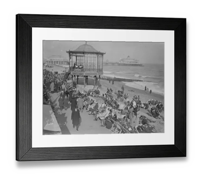Framed Print : Holiday beach loungers at Eastbourne. So warm has been the weather on the south Framed Print : Holiday beach loungers at Eastbourne. So warm has been the weather on the south