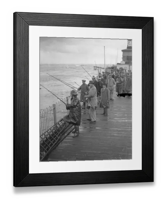 Framed Print : Hastings angling festival opens in a gale. With a stiff gale whipping up the sea Framed Print : Hastings angling festival opens in a gale. With a stiff gale whipping up the sea