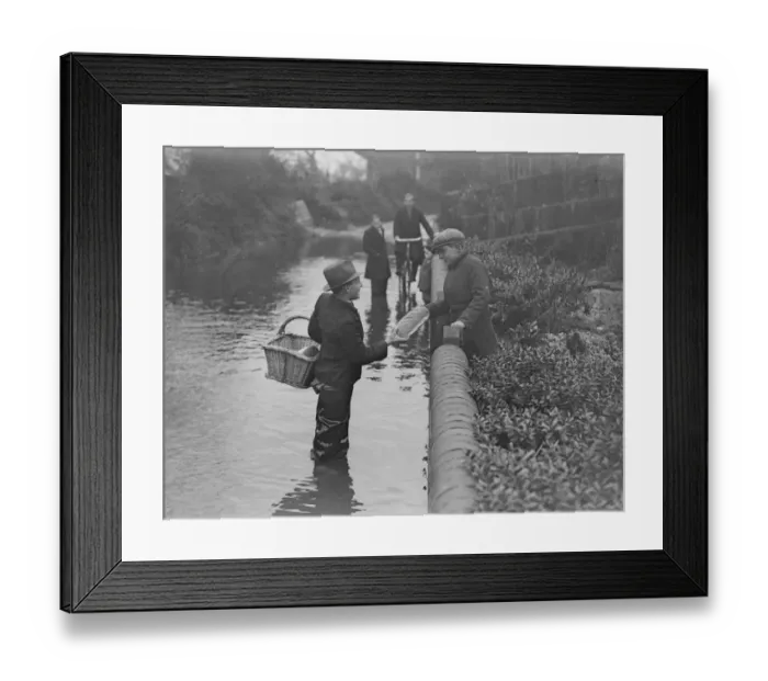 Framed Print : Delivering the goods. Despite the flood. Wading almost knee deep in the flood waters Framed Print : Delivering the goods. Despite the flood. Wading almost knee deep in the flood waters