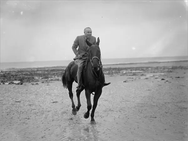 Mr Hore Belisha spends his holiday - on horseback. Away from transport problems