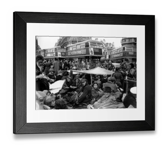 Framed Print : An improvised shelter made from a tarpaulion provides shelter from the rain for a Framed Print : An improvised shelter made from a tarpaulion provides shelter from the rain for a