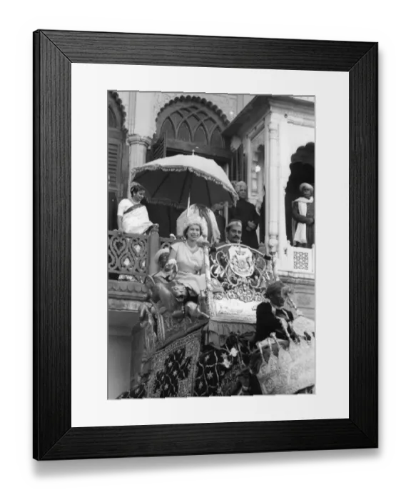 Framed Print : H. M. Queen Elizabeth II rides on an elephant through the streets of Benares, leaving Framed Print : H. M. Queen Elizabeth II rides on an elephant through the streets of Benares, leaving
