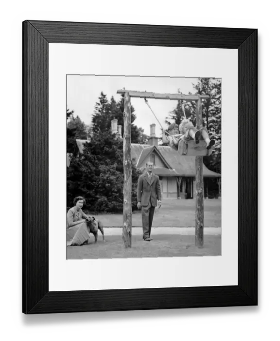 Framed Print : Flying High. Prince Charles and Princess Anne chuckle delightedly as they soar up