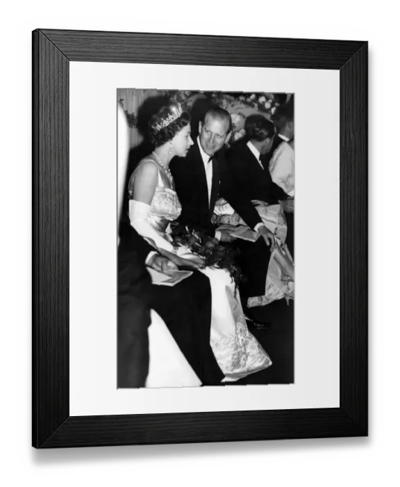 Framed Print : The Duke of Edinburgh turns to talk with H M The Queen Elizabeth II as they take Framed Print : The Duke of Edinburgh turns to talk with H M The Queen Elizabeth II as they take