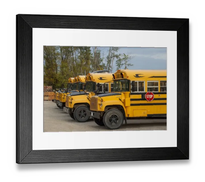 Framed Print : GMC school busses parked up at their depot