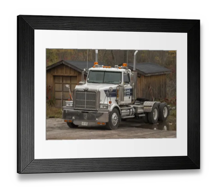 Framed Print : A white 6 x4 Western star tractor unit parked up at a rural Ontario timber yard Framed Print : A white 6 x4 Western star tractor unit parked up at a rural Ontario timber yard