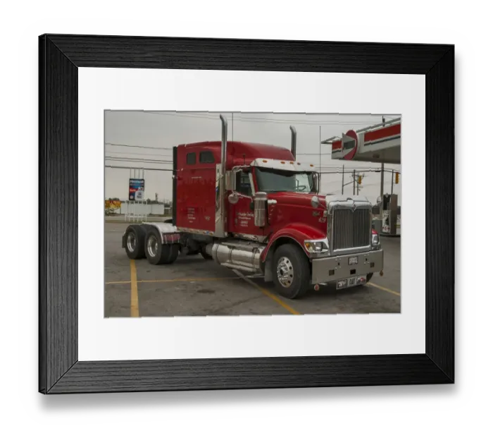 Framed Print : Red International eagle 6 x4 semi at a service station on the outskirts of Framed Print : Red International eagle 6 x4 semi at a service station on the outskirts of