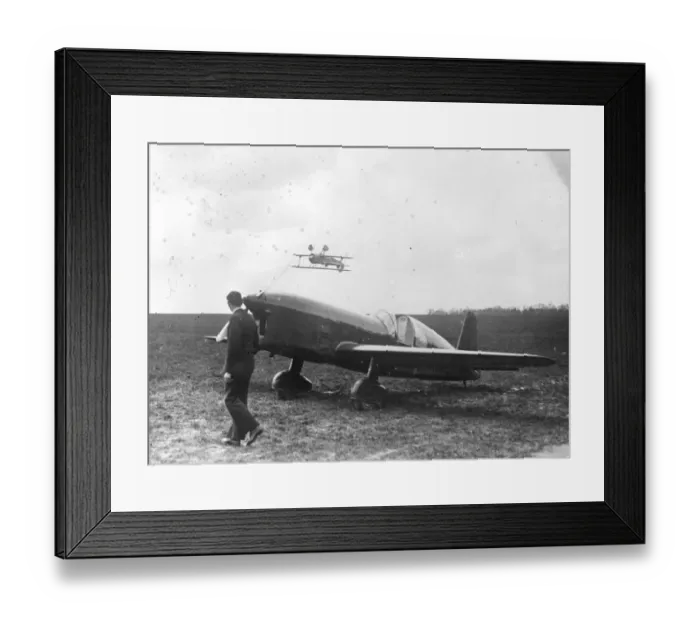 Framed Print : Wings first. M Massotte, one of Frances leading stunt pilots, almost skimming Framed Print : Wings first. M Massotte, one of Frances leading stunt pilots, almost skimming