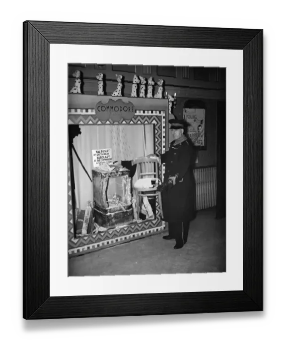Framed Print : The cinema usher at the Commodore Theatre, Orpington standing by a display of Framed Print : The cinema usher at the Commodore Theatre, Orpington standing by a display of