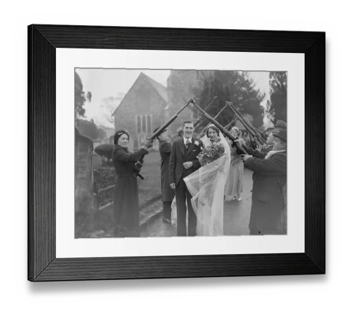 Framed Print : The Acton and Clarke wedding at Crayford. The bride and groom walk through a guard Framed Print : The Acton and Clarke wedding at Crayford. The bride and groom walk through a guard