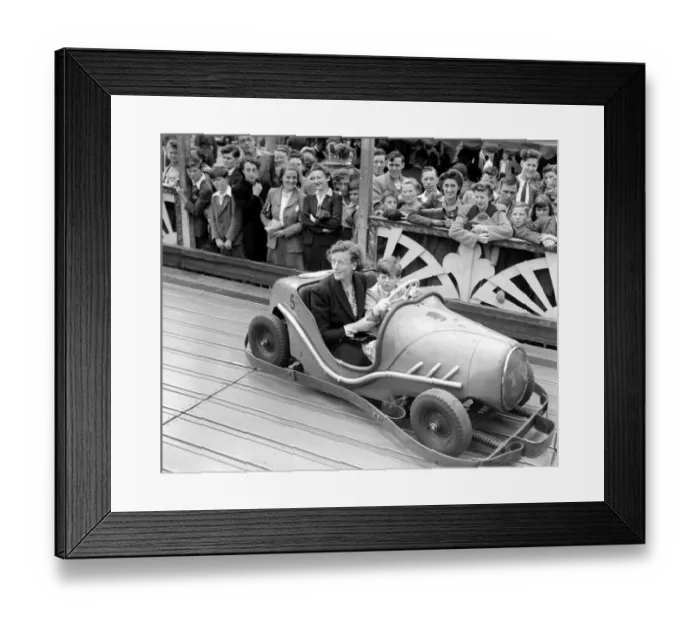 Framed Print : Princess Edward of Kent in a dodgem Car with his nanny at Agars Plough Slough. August Framed Print : Princess Edward of Kent in a dodgem Car with his nanny at Agars Plough Slough. August