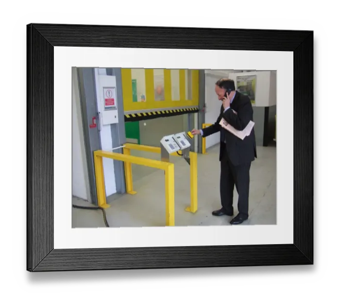 Framed Print : Business man entering a building using a swipe card. ?TopFoto
