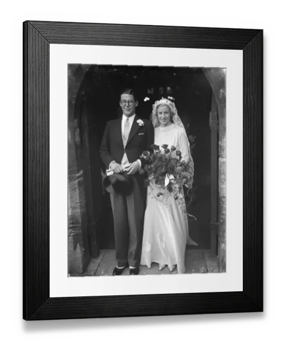 Framed Print : The Miles and Crabb wedding at Orpington, Kent. The bride and groom as they leave the church Framed Print : The Miles and Crabb wedding at Orpington, Kent. The bride and groom as they leave the church