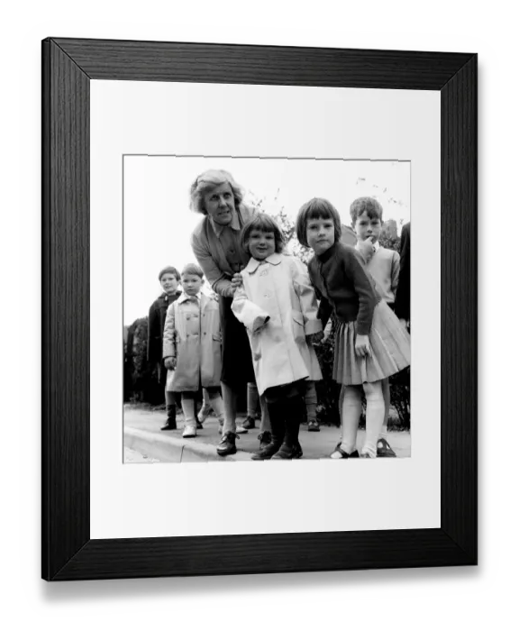 Framed Print : In Safe Hands - Miss Irene Fowler who runs a kindergarten school in Knockholt, Kent