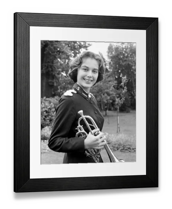 Framed Print : Carole Reinhart a 20 year old music student plays in a Salvation Army Band in Miami, Florida Framed Print : Carole Reinhart a 20 year old music student plays in a Salvation Army Band in Miami, Florida