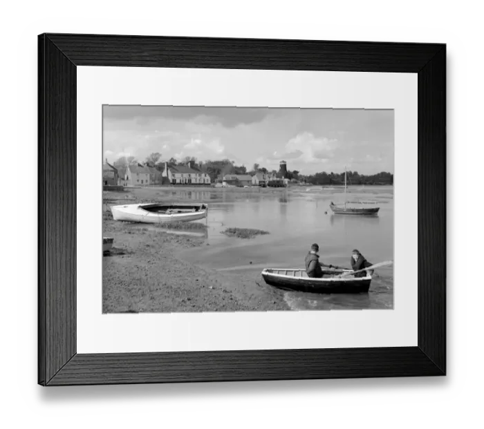Framed Print : Boys in boat with The Royal Oak at Langstone Harbour in jthe background, Langstone
