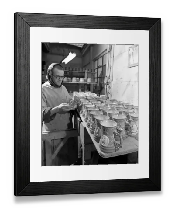 Framed Print : Monk makes Coronation monks. Brother Thomas inspecting completed coronation mugs
