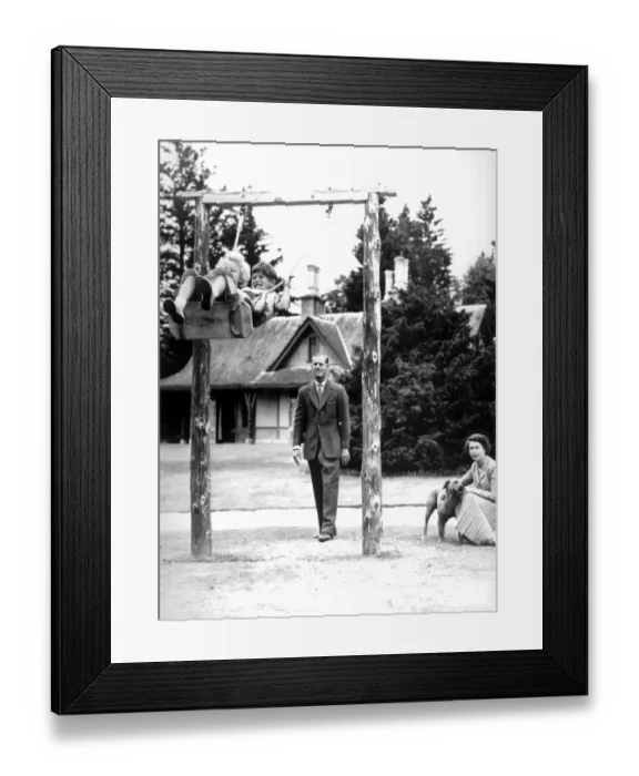 Framed Print : Prince Charles & Princess Anne chuckle delightedly on the swing at Balmoral Castle