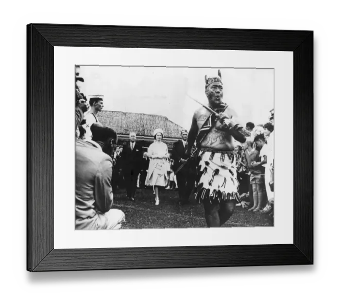 Framed Print : A Maori chief performing a dance of welcome before Queen Elizabeth II during celebrations Framed Print : A Maori chief performing a dance of welcome before Queen Elizabeth II during celebrations
