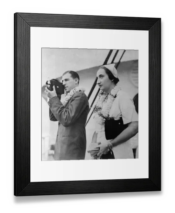 Framed Print : Royal cameraman. Prince Juan and his bride arrive in Hawaii on honeymoon tour Framed Print : Royal cameraman. Prince Juan and his bride arrive in Hawaii on honeymoon tour