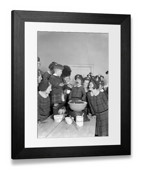 Framed Print : Christmas prepartations at the Royal Caledonian Schools, Bushey. Tasting pudding Framed Print : Christmas prepartations at the Royal Caledonian Schools, Bushey. Tasting pudding