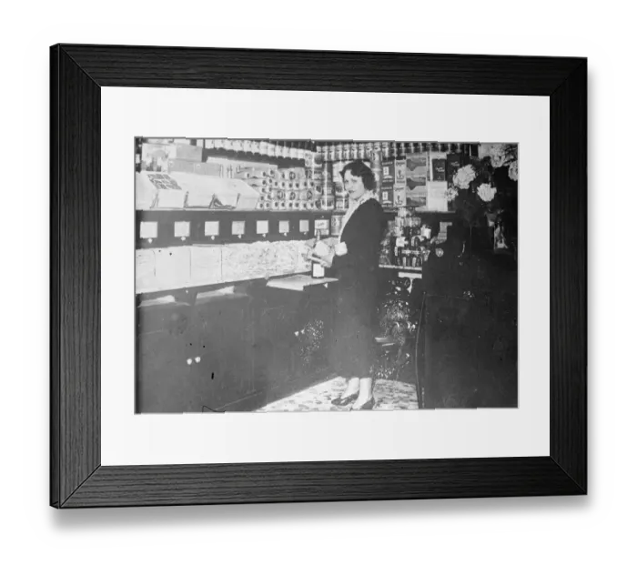 Framed Print : Mlle. Cotillon at the shop in which she will now work in Paris. She was mentioned Framed Print : Mlle. Cotillon at the shop in which she will now work in Paris. She was mentioned