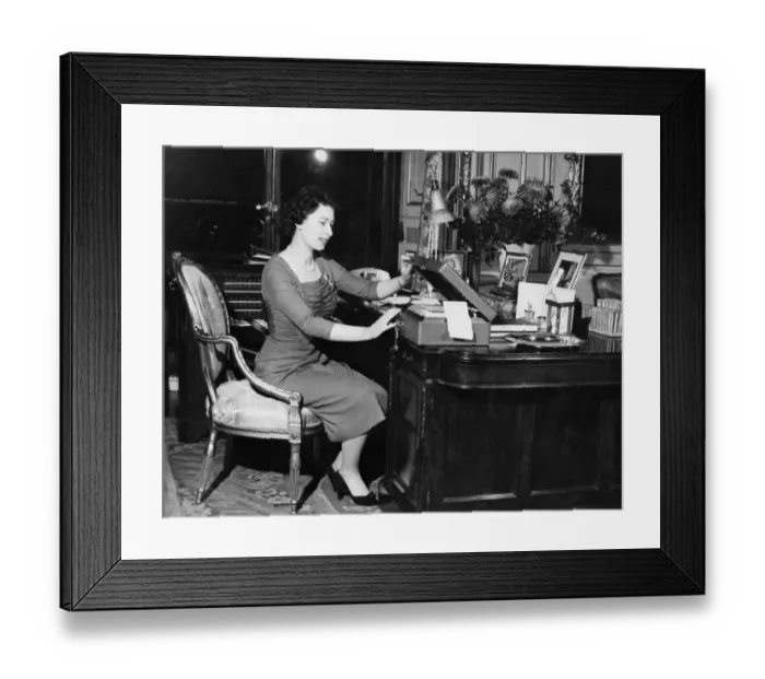 Framed Print : HM Queen Elizabeth II at her desk in Buckingham Palace as she opens one of the boxes Framed Print : HM Queen Elizabeth II at her desk in Buckingham Palace as she opens one of the boxes