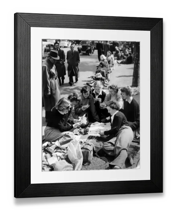 Framed Print : Students from London University pass the time playing cards in their position in