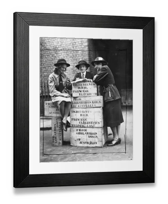 Framed Print : Three Australian Girl Guides check over some of the ingredients at the Girl Guide