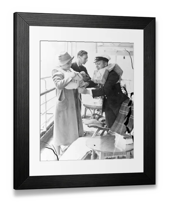Framed Print : The King and Queen trying on their lifebelts on the liner Empress of Australia Framed Print : The King and Queen trying on their lifebelts on the liner Empress of Australia