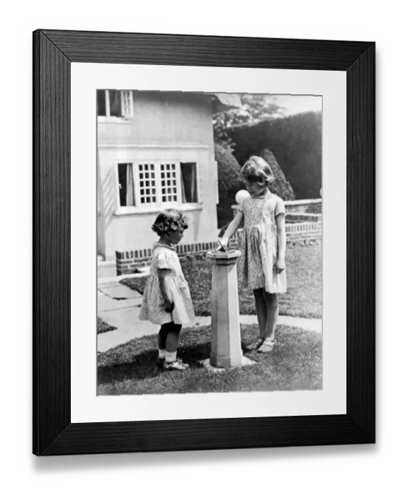 Framed Print : Princesses Elizabeth and Margaret Rose in the grounds of the model house presented