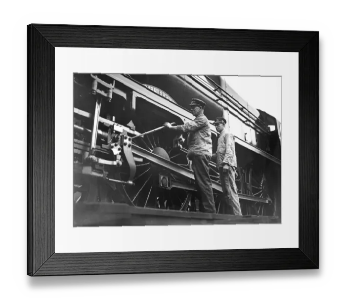 Framed Print : F C Bishop the driver of the Royal Scot ands Banting checking the engine before