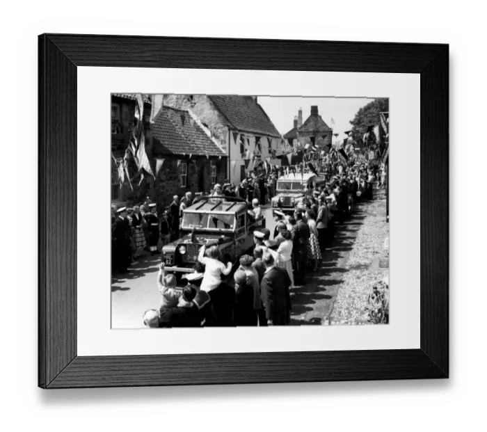 Framed Print : Driving through the streets in a Land Rover the Queen smiles at the crowds on either side Framed Print : Driving through the streets in a Land Rover the Queen smiles at the crowds on either side