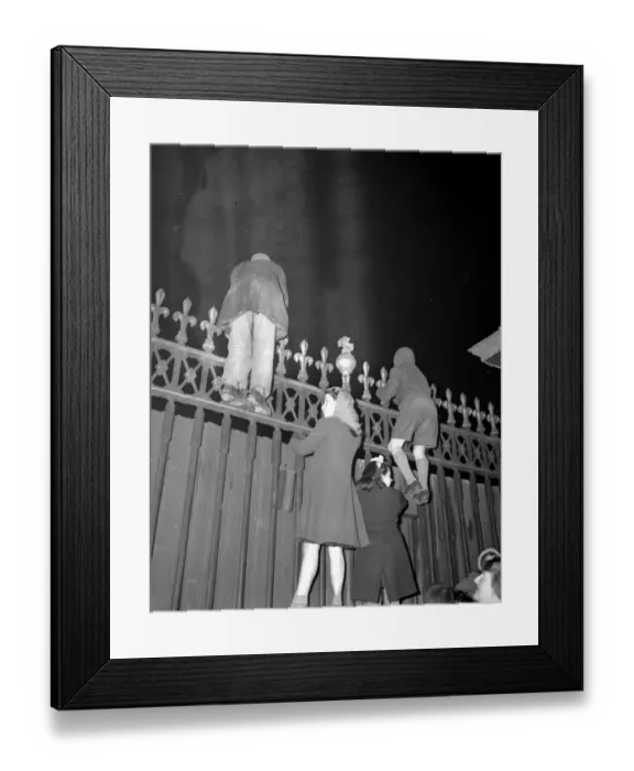 Framed Print : Children among the crowds outside the Palace tonight climbed the railings to get Framed Print : Children among the crowds outside the Palace tonight climbed the railings to get