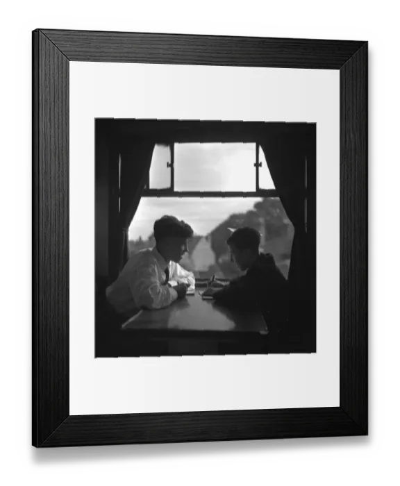 Framed Print : Trainspotters Club outing Two young trainspotters plan their day in the railway carriage Framed Print : Trainspotters Club outing Two young trainspotters plan their day in the railway carriage